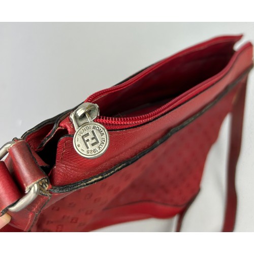 12 - A VINTAGE FENDI SIDE BAG IN BLOOD RED, interlocking 'FF' emblems throughout with a central circular ... 