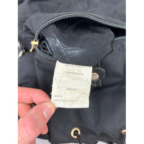 43 - A VINTAGE MOSCHINO BACKPACK RUCKSACK, black with gold hardware spelling out 'Moschino' with various ... 