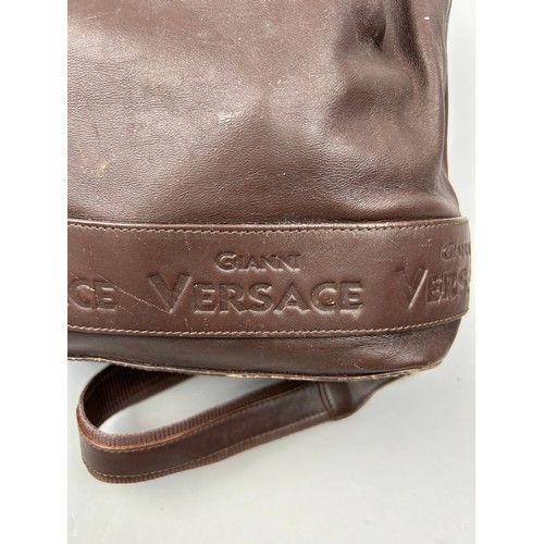 42 - A VINTAGE GIANNI VERSACE BROWN LEATHER BACKPACK RUCKSACK, 

32cm x 30cm 

Overall good condition. So... 