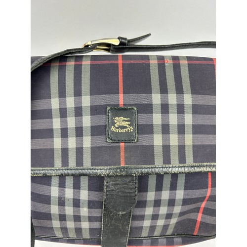 31 - A VINTAGE BURBERRY'S SATCHEL BAG, with blue 'nova check' design throughout and blue leather straps

... 
