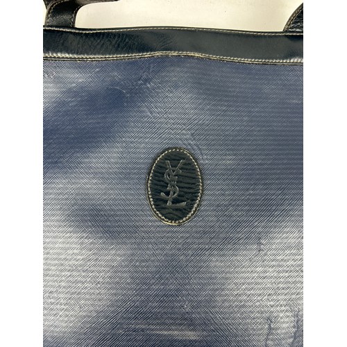 29 - A VINTAGE YVES SAINT LAURENT TOTE BAG, royal blue with central 'YSL' emblem and blue leather straps
... 