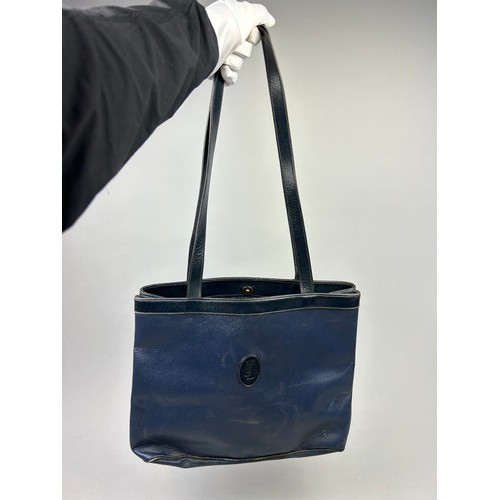 29 - A VINTAGE YVES SAINT LAURENT TOTE BAG, royal blue with central 'YSL' emblem and blue leather straps
... 