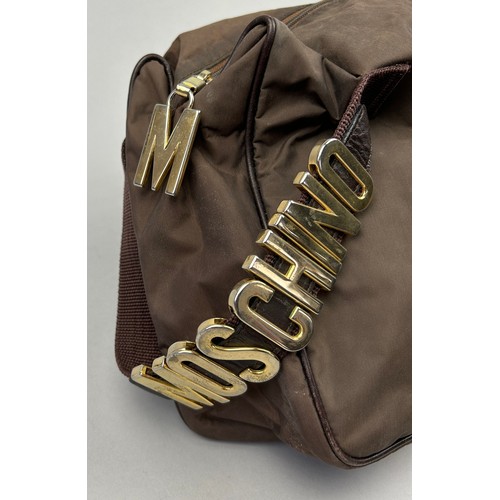 30 - A VINTAGE MOSCHINO SIDE BAG, light brown coloured nylon exterior with brown strap, 'Moschino' gold m... 