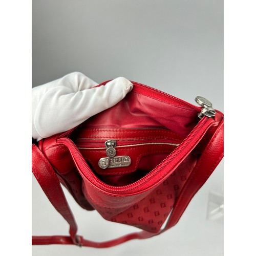 13 - A VINTAGE FENDI SIDE BAG IN BLOOD RED, interlocking 'FF' emblems throughout and red leather straps. ... 