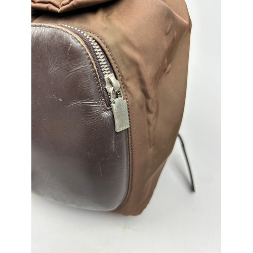 47 - A BURBERRY'S LARGE RUCKSACK BACKPACK AND AN ICEBERG JEANS BROWN NYLON RUCKSACK, 

The Burberry's wit... 