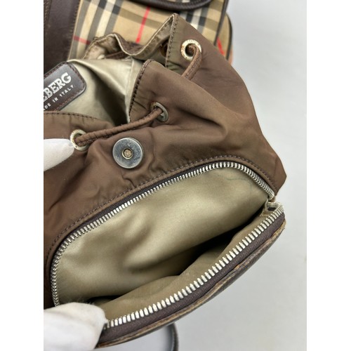 47 - A BURBERRY'S LARGE RUCKSACK BACKPACK AND AN ICEBERG JEANS BROWN NYLON RUCKSACK, 

The Burberry's wit... 