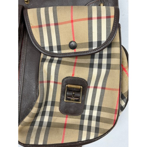 47 - A BURBERRY'S LARGE RUCKSACK BACKPACK AND AN ICEBERG JEANS BROWN NYLON RUCKSACK, 

The Burberry's wit... 