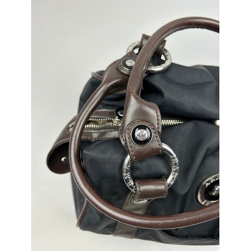 34 - AN ARMANI JEANS BLACK NYLON HANDBAG, with brown leather straps and chrome emblem

38cm x 35cm 

Very... 