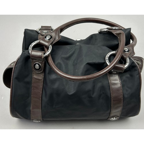 34 - AN ARMANI JEANS BLACK NYLON HANDBAG, with brown leather straps and chrome emblem

38cm x 35cm 

Very... 