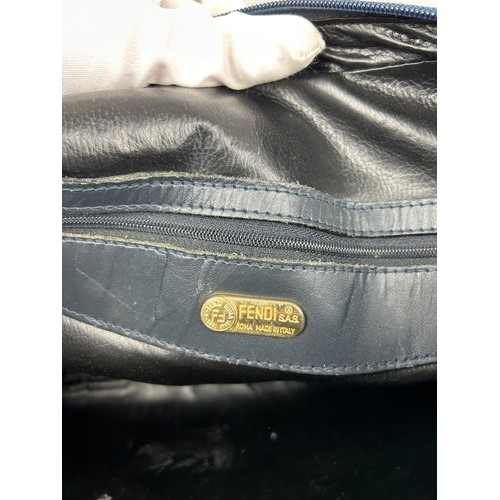 14 - A VINTAGE FENDI HANDBAG, blue strips with gold coloured metal hardware and central zipped compartmen... 