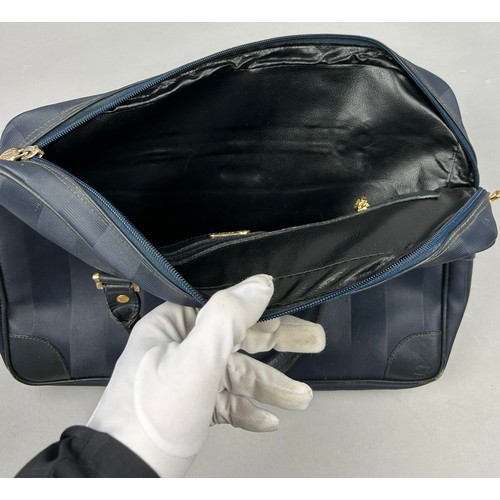 14 - A VINTAGE FENDI HANDBAG, blue strips with gold coloured metal hardware and central zipped compartmen... 