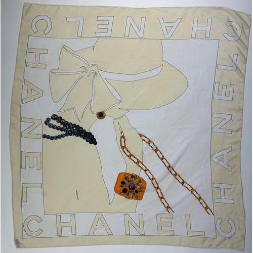 119 - A LARGE VINTAGE CHANEL SILK SCARF DEPICTING A LADY WEARING A HAT AND VARIOUS GOLD JEWELLERY,

85cm x... 