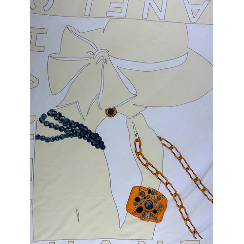 119 - A LARGE VINTAGE CHANEL SILK SCARF DEPICTING A LADY WEARING A HAT AND VARIOUS GOLD JEWELLERY,

85cm x... 