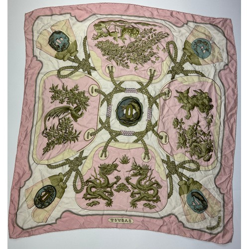 126 - A LARGE VINTAGE HERMES PARIS SILK SCARF, in white gold and pink depicting dragons and gold chains

8... 