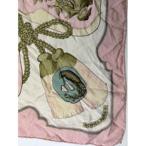 126 - A LARGE VINTAGE HERMES PARIS SILK SCARF, in white gold and pink depicting dragons and gold chains

8... 