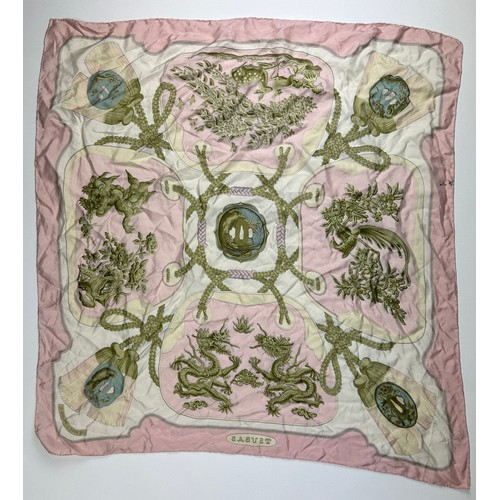 126 - A LARGE VINTAGE HERMES PARIS SILK SCARF, in white gold and pink depicting dragons and gold chains

8... 