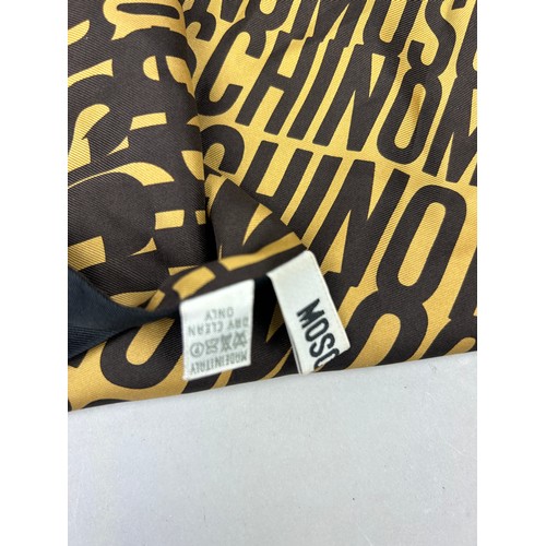 120 - A VINTAGE MOSCHINO SILK SCARF IN BLACK AND YELLOW WITH MONOGRAM PRINT THROUGHOUT,

150cm in length 
... 