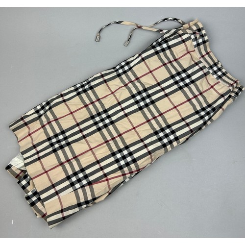 107 - A VINTAGE BURBERRY SKIRT WITH NOVA CHECK PRINT THROUGHOUT,

UK Size 14