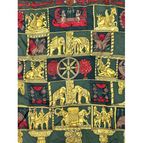 125 - A VINTAGE HERMES SILK SCARF IN THE CLASSICAL STYLE, green, gold and red decorated with lions, peacoc... 