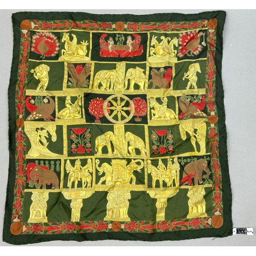 125 - A VINTAGE HERMES SILK SCARF IN THE CLASSICAL STYLE, green, gold and red decorated with lions, peacoc... 