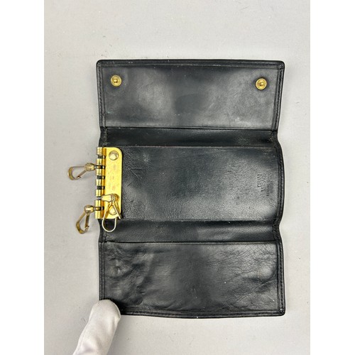 59 - A VERSACE BLACK LEATHER WALLET, with gold coloured hardware