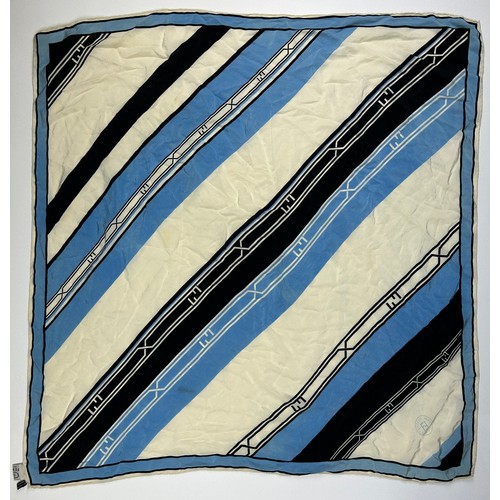 127 - A VINTAGE FENDI SILK SCARF, blue, cream and black,

75cm x 75cm 

Good condition, light marks.