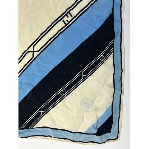 127 - A VINTAGE FENDI SILK SCARF, blue, cream and black,

75cm x 75cm 

Good condition, light marks.