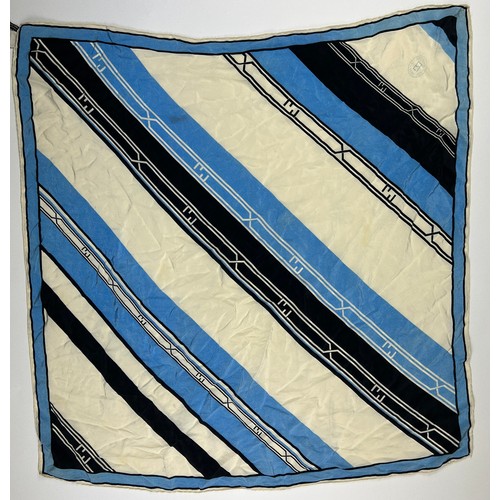 127 - A VINTAGE FENDI SILK SCARF, blue, cream and black,

75cm x 75cm 

Good condition, light marks.