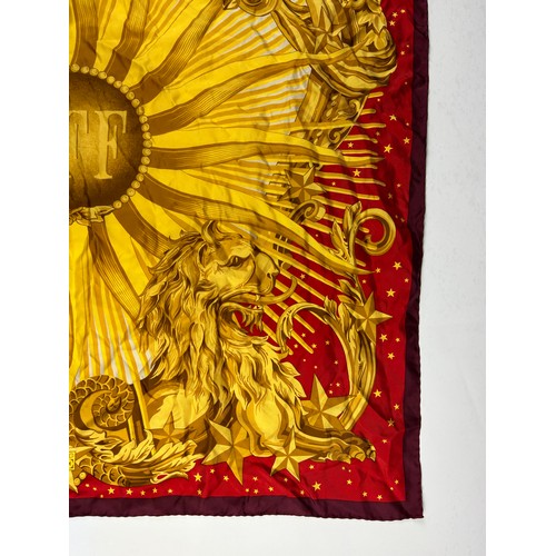 128 - A VINTAGE GIANFRANCO FERREGAMO SILK SCARF, red and gold depicting regal lions and eagles

85cm x 85c... 