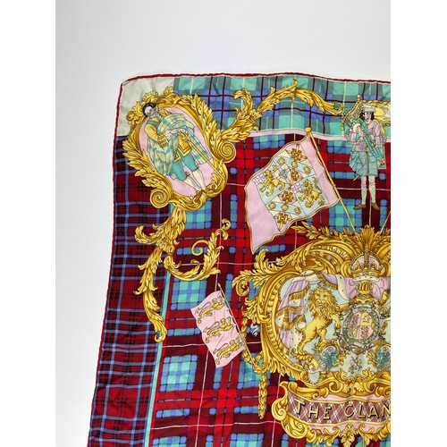 129 - A VINTAGE VERSACE SILK SCARF, plaid and chequered pattern 'The Clans' with royal crests and emblems ... 