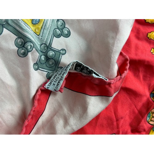 132 - A LARGE VINTAGE HERMES SILK SCARF, red, gold and pink depicting various articles of archaic jeweller... 