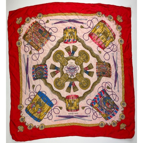 136 - A LARGE VINTAGE HERMES SILK SCARF, red, gold and pink with instrument design throughout

75cm x 75cm... 