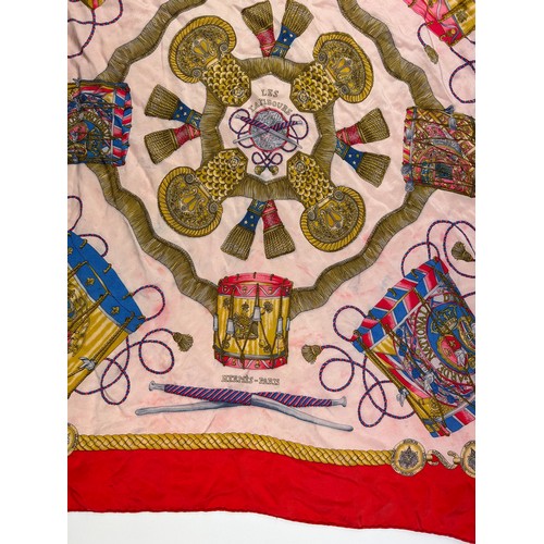 136 - A LARGE VINTAGE HERMES SILK SCARF, red, gold and pink with instrument design throughout

75cm x 75cm... 