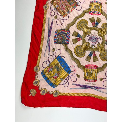 136 - A LARGE VINTAGE HERMES SILK SCARF, red, gold and pink with instrument design throughout

75cm x 75cm... 