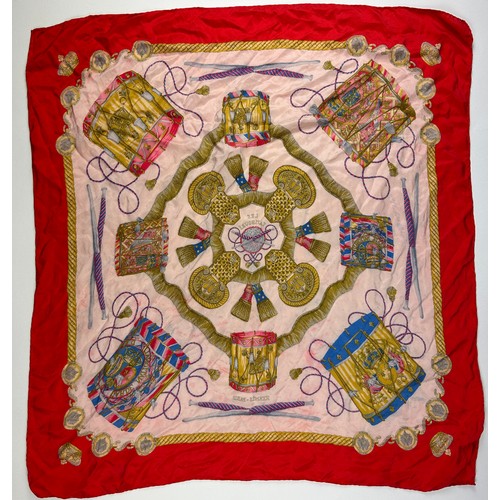 136 - A LARGE VINTAGE HERMES SILK SCARF, red, gold and pink with instrument design throughout

75cm x 75cm... 