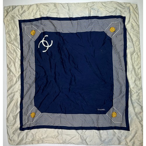 118 - A VINTAGE CHANEL SILK SCARF, navy blue and white with interlocking 'CC' emblems and gold buckle deta... 