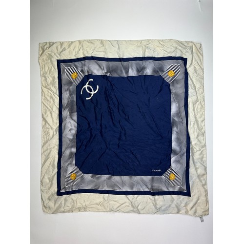 118 - A VINTAGE CHANEL SILK SCARF, navy blue and white with interlocking 'CC' emblems and gold buckle deta... 