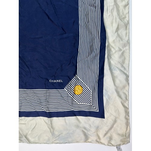 118 - A VINTAGE CHANEL SILK SCARF, navy blue and white with interlocking 'CC' emblems and gold buckle deta... 