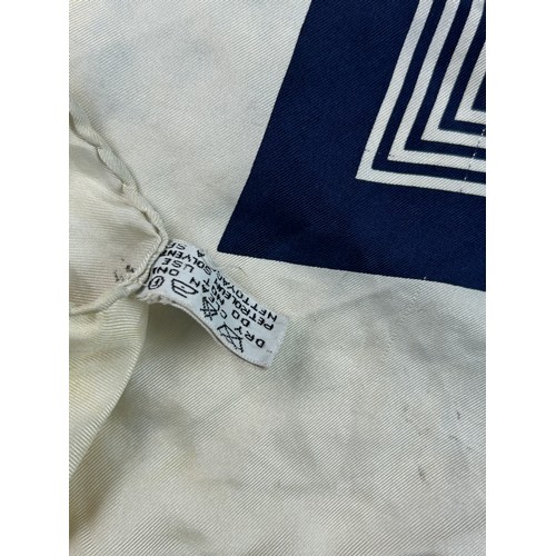 118 - A VINTAGE CHANEL SILK SCARF, navy blue and white with interlocking 'CC' emblems and gold buckle deta... 