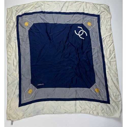 118 - A VINTAGE CHANEL SILK SCARF, navy blue and white with interlocking 'CC' emblems and gold buckle deta... 