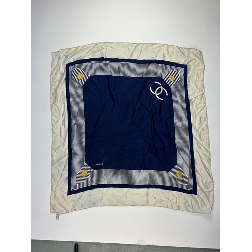 118 - A VINTAGE CHANEL SILK SCARF, navy blue and white with interlocking 'CC' emblems and gold buckle deta... 