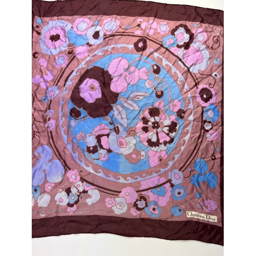 137 - A VINTAGE CHRISTIAN DIOR SILK SCARF, of blossoming foliate design blue, pink and purple with 'Christ... 