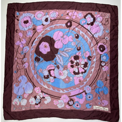 137 - A VINTAGE CHRISTIAN DIOR SILK SCARF, of blossoming foliate design blue, pink and purple with 'Christ... 