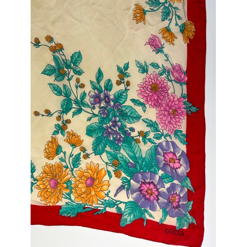 138 - A LARGE VINTAGE GUCCI SILK SCARF, of foliate design with green, orange, pink, purple and beige colou... 