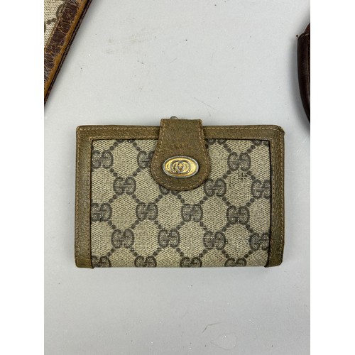 58 - A SELECTION OF VINTAGE GUCCI PURSES AND WALLETS (4)