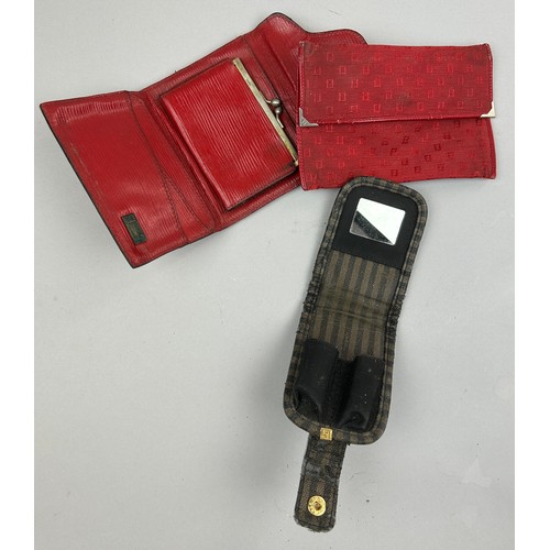 57 - A SELECTION OF FIVE VINTAGE FENDI WALLETS AND ACCESSORIES, to include two red, one brown vanity set,... 