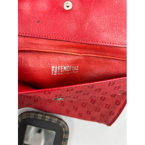 57 - A SELECTION OF FIVE VINTAGE FENDI WALLETS AND ACCESSORIES, to include two red, one brown vanity set,... 