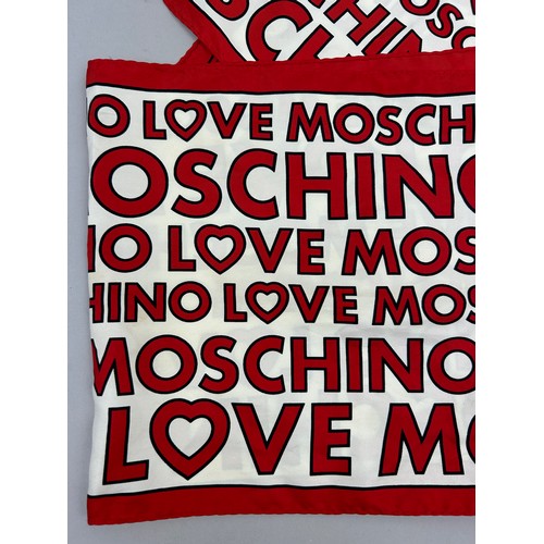 141 - A LOVE MOSCHINO SILK SCARF, in red and white with spell out print throughout

135cm x 25cm 

Very go... 
