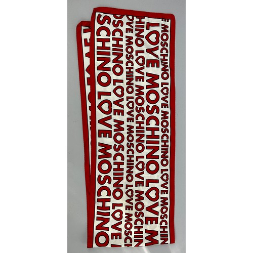 141 - A LOVE MOSCHINO SILK SCARF, in red and white with spell out print throughout

135cm x 25cm 

Very go... 