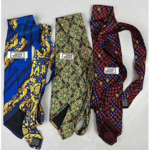 144 - THREE RARE VINTAGE GIANNI VERSACE GENTLEMAN'S NECK TIES, brightly coloured with Gianni Versace label... 